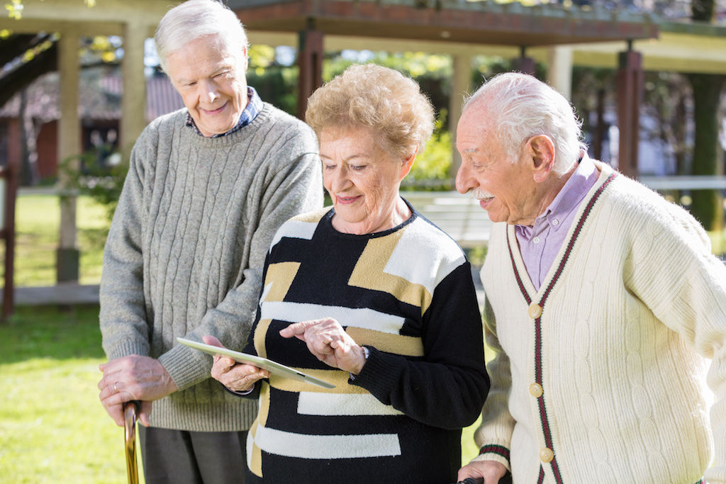 Three senior adults making friends in apartment community